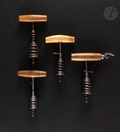null Four corkscrews with iron spring cage. Handle wood or bakelite some marked "VICHY...