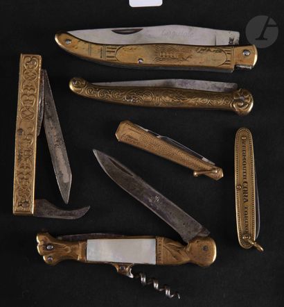 Six folding knives in brass marked 