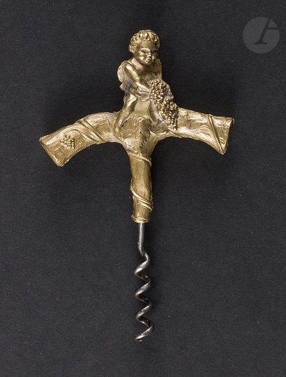 null Simple corkscrew, the bronze handle showing a cherub in the vine.

Height :...