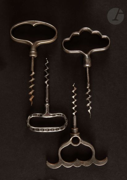 null Four simple corkscrews in iron, the handles with ring.

One marked "OH".

Heights:...