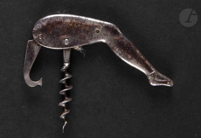 null CHARLES PUDDEFOOT

Iron corkscrew of wine waiter forming a leg of lady.

Marked...