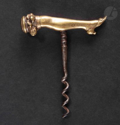  Simple corkscrew, the bronze handle showing a lady's leg with shoe and garter belt....