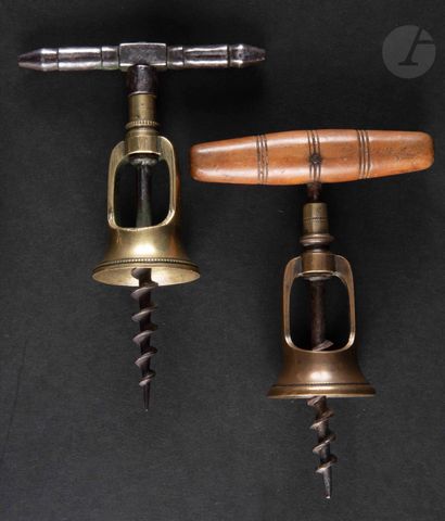 null Two corkscrews with brass bell type cage, the handles in metal or wood.

Close...