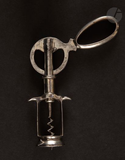  FERNAND FRANçOIS 
Lever corkscrew in nickel-plated metal, the handle forming an...