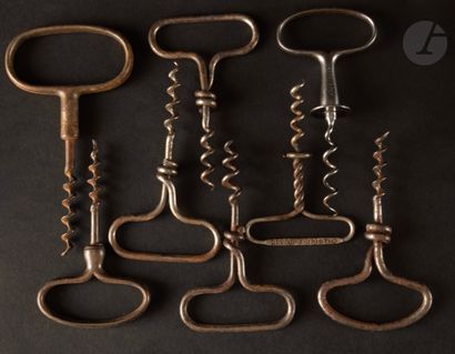 null Eight simple corkscrews in iron or wire wound, the handles with ring. Some marked...
