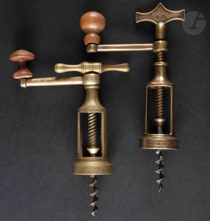 null Two corkscrews with brass cage, the handle of type coffee grinder with wooden...