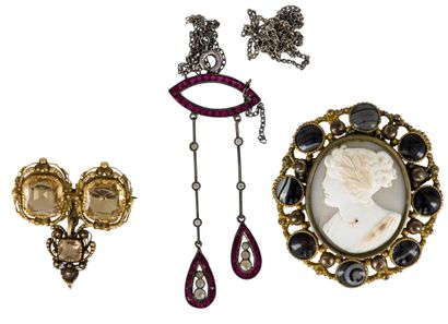 null Lot of metal jewelry including: a brooch decorated with a cameo in a surround...