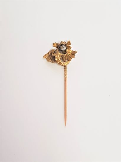 null 18K (750) gold lapel pin with a chimera holding an old cut diamond in its mouth....