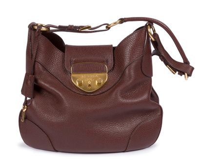 PRADA. Brown grained leather bag, gilded...