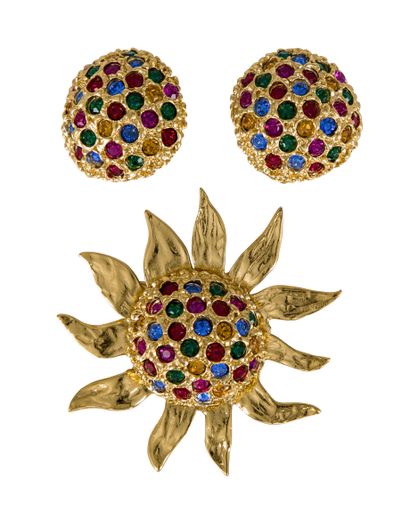 null Yves SAINT LAURENT. Set including a sun brooch and a pair of matching ear clips...