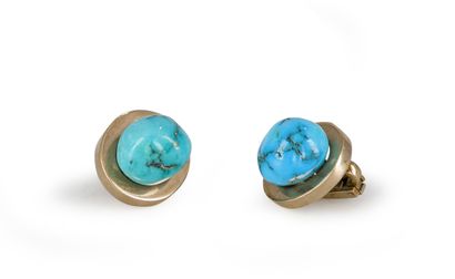 null Pair of ear clips in 14K gold (585), adorned with rough turquoise cabochons....