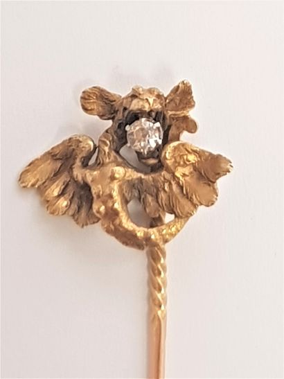 null 18K (750) gold lapel pin with a chimera holding an old cut diamond in its mouth....