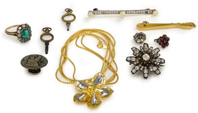 null Lot of costume jewelry including: a silver flower brooch decorated with fake...