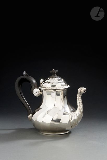 null DOUAI 1767
Silver teapot with twisted ribs extending on the doucine lid lined...