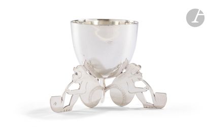 null FRANCE SECOND HALF OF THE 20th CENTURY
Silver egg cup resting on a base featuring...
