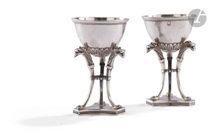 null PARIS 1819 - 1838
A pair of silver egg cups resting on a three-sided base with...