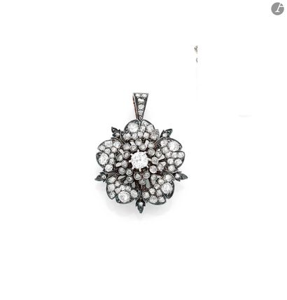 null Silver and gold rosehip flower pendant, the pistil adorned with an old-cut diamond...
