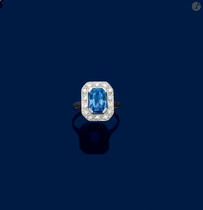 null 18K (750) white gold and platinum ring set with an octagonal sapphire surrounded...