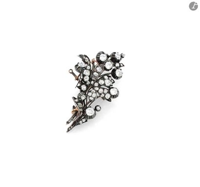 Silver flower brooch set with old cut diamonds....