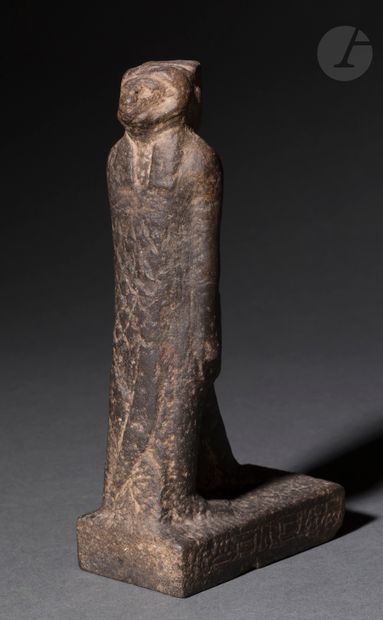 null Statue representing on one side a god Amun walking, and on the other a Khnum...