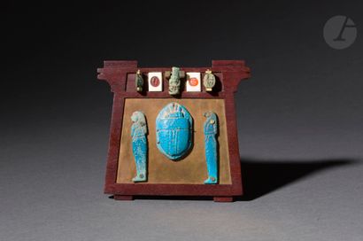 null Modern mounting showing a pectoral on which is mounted an ancient winged scarab...