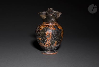 null Oenochoe with three-lobed beak 
Decorated with a scene showing on the left a...