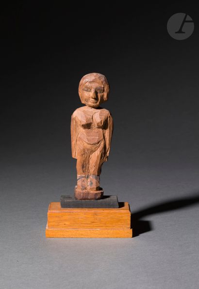 null Statuette representing a female character standing with her arms along her body
Wood...
