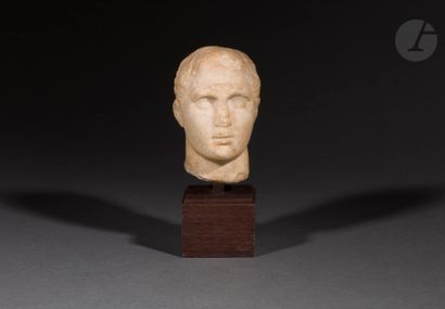 null Male head in high relief probably representing an athlete
Marble. Erosion on...