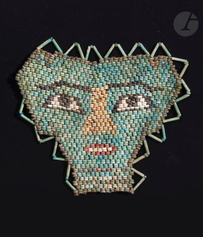 null Mummy's net showing a mask
Modern assembly. 
Polychrome earthenware. 
Egypt,...