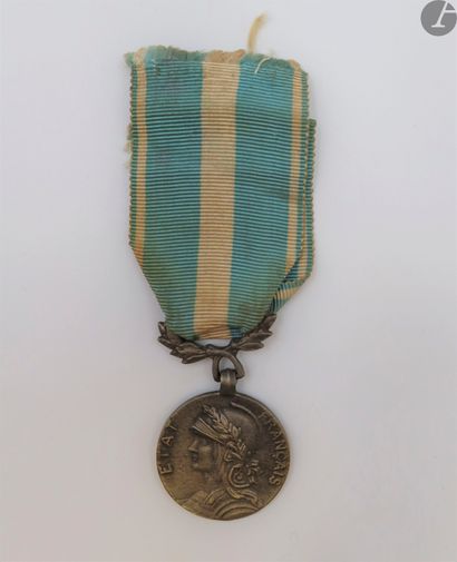 null FRANCISM
COLONIAL
MEDAL
(1893)
Colonial medal said "of the French State".
In...