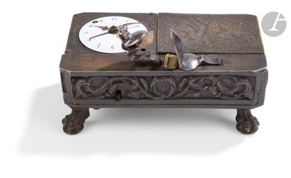 null Beautiful case pistol lighter clock. 
Patinated brass box with foliage decoration,...