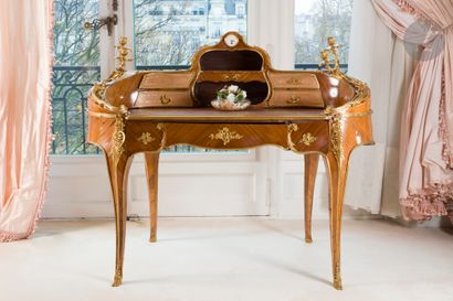 Rosewood and gilt bronze desk, with a clock...