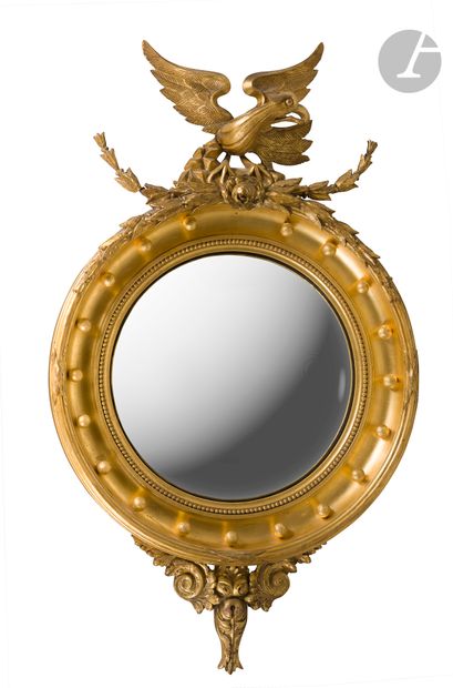 Miroir sorcière en bois doré de forme circulaire,...