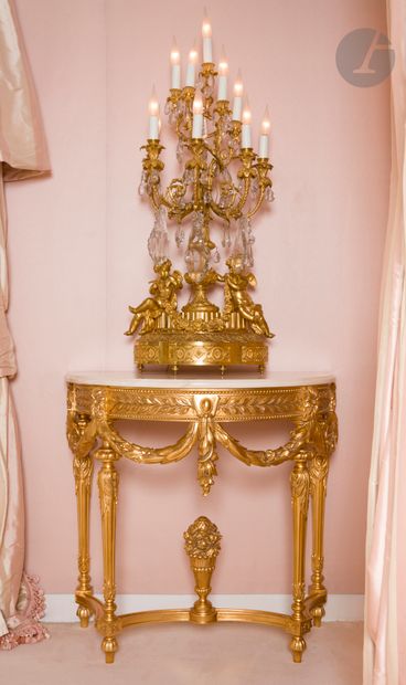 Pair of half-moon console tables decorated...