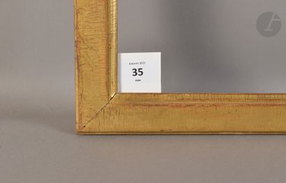 null Baguette plate en bois mouluré et doré. Époque Louis XVI (usures). 51 x 64,8 cm...
