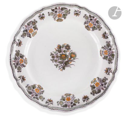 MOUSTIERS
Plate with contoured edge in earthenware,...