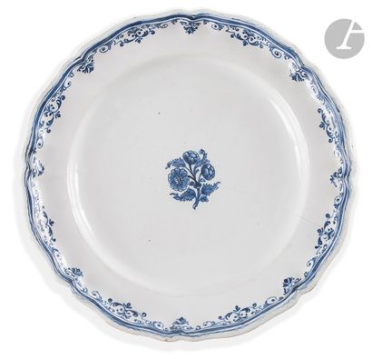 null MOUSTIERS
Three plates with contoured edge in earthenware, decorated in blue...