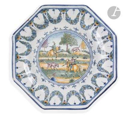 null MOUSTIERS 
Two plates of octagonal shape with cut sides in earthenware, decorated...