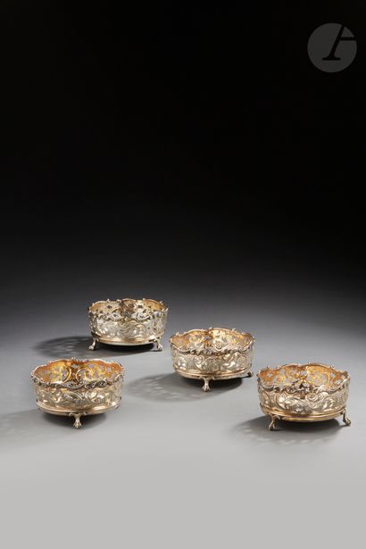 null LONDON 1837 - 1838
Four silver coasters partially gilded and wood on three claw...