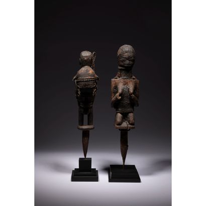 null A batch of two voodoo piquet statuettes, one of which is female, hands supporting...