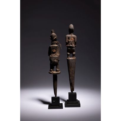 null A group of two very old male voodoo stakes statuettes of bewitchment and control...