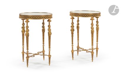  Pair of circular tables in gilt bronze in the Adam Weisweiler style, with caryatid... Gazette Drouot