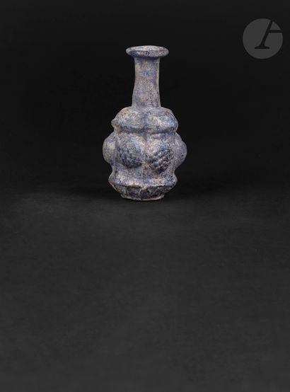 null Sidonian-style bottle with hexagonal body
Decorated on each side with a motif...