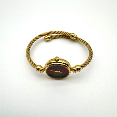GUCCI
Montre bracelet à quartz en métal doré...