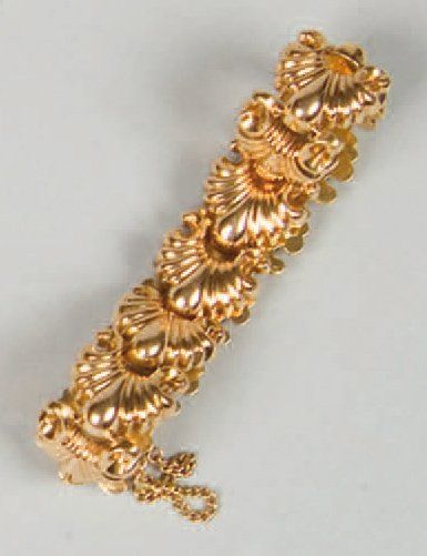Bracelet articulé en or jaune à décor de...