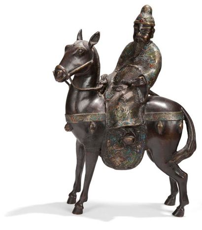 JAPON - Vers 1900 
Statuette de Toba sur sa mule en bronze à patine brune et émaux...