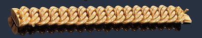 null Bracelet en or jaune 18K (750‰), articulé de maillons gourmette. 
Longueur :...