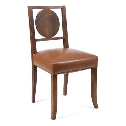 Victor COURTRAY (1896-1987) attribué à Suite de dix chaises en chêne maillé et teinté.
Les...