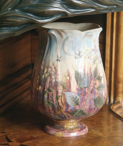 Émile GALLÉ (1846-1904). Vase tulipe en faïence fine à décor de fleurs et insectes....