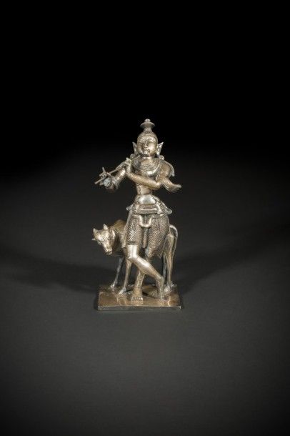 null Krishna jouant de la flûte, Inde du nord, seconde moitié du XIXe siècle.
Statuette...